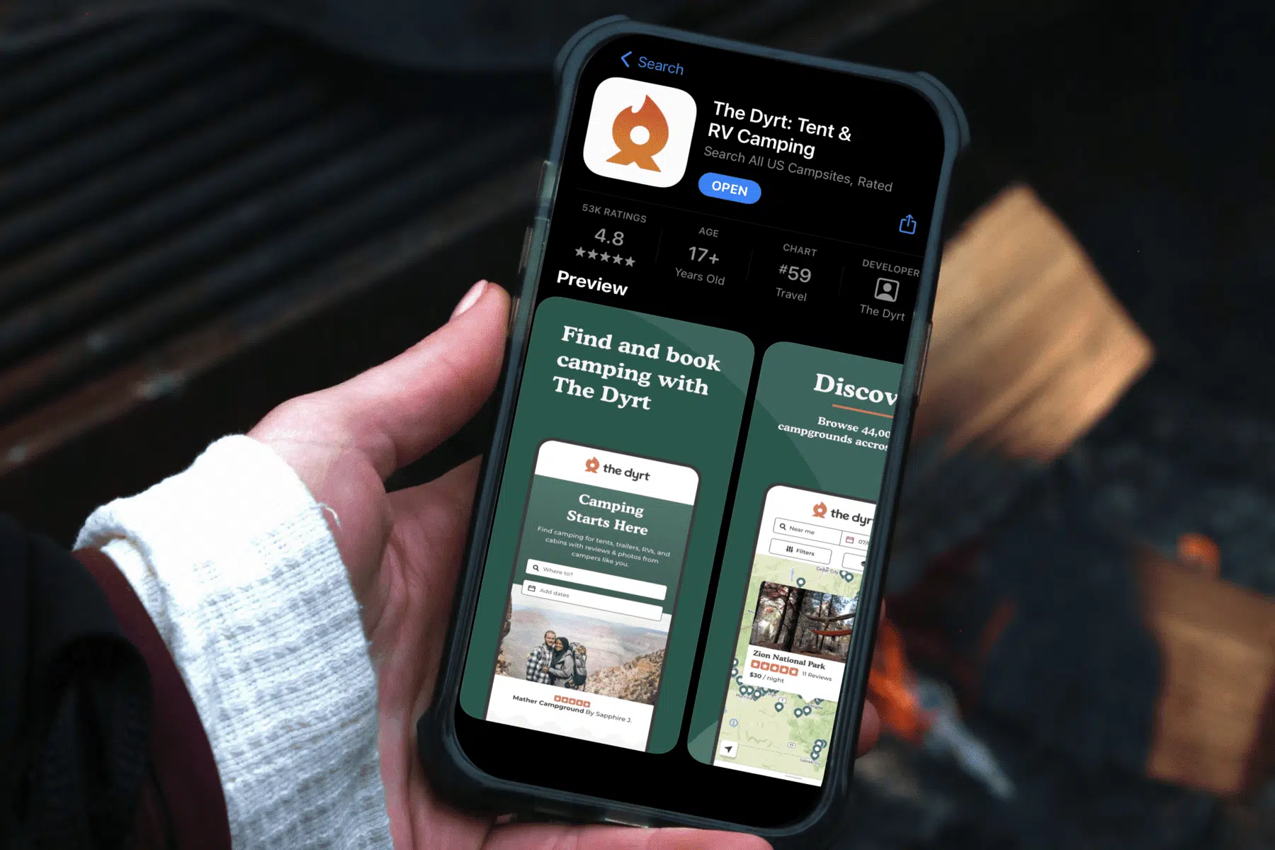 A camper using The Dyrt camping app on their iPhone.