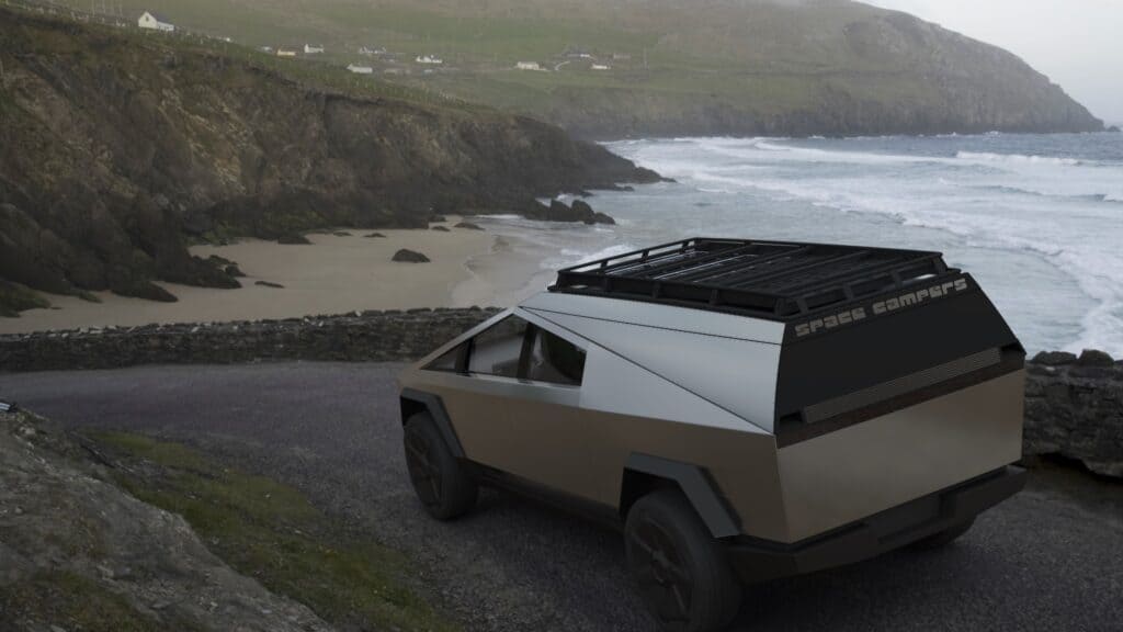 A Tesla Cybertruck is parked on the side of a road near the ocean.