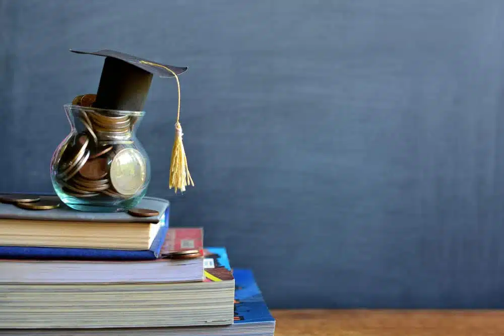 A graduation hat sits on top of a stack of books while Kevin Phillips Scholarship applications are being accepted at RVTI.