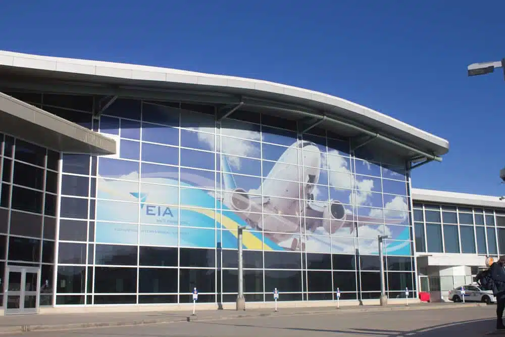 A large building at the Edmonton International Airport with a large advertisement on the front, expanding supply chain capacity in Canada.