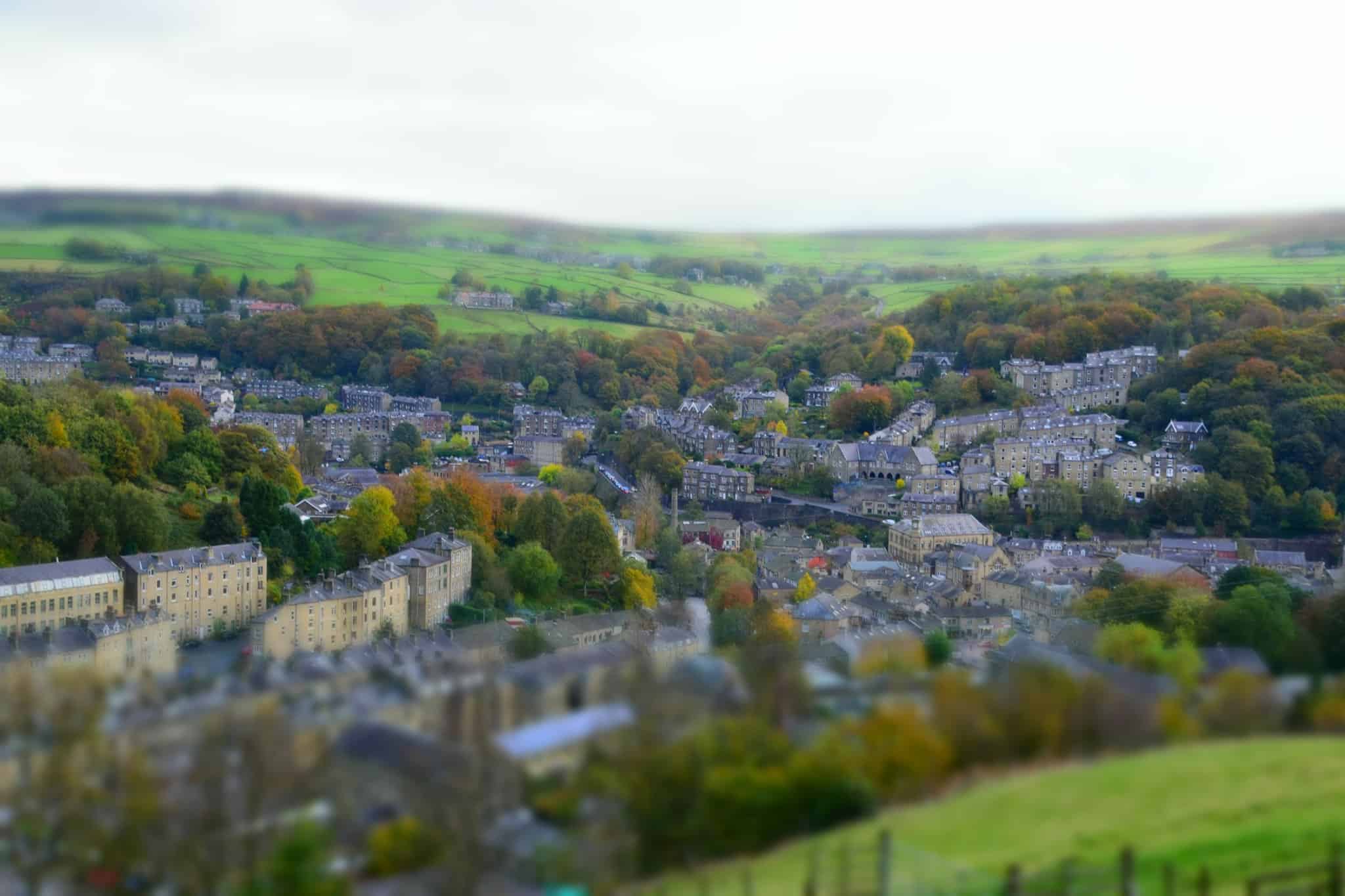 A view of a small town in England, showcasing its farm sustainability initiatives and charming glamping pods.