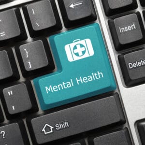 A blue button with the words "mental health" on it, promoting awareness and support for mental health in Canada.