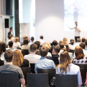 Attendees at the 2022 RVDA Convention gathering in an auditorium to learn about effective Employee Onboarding Strategies.
