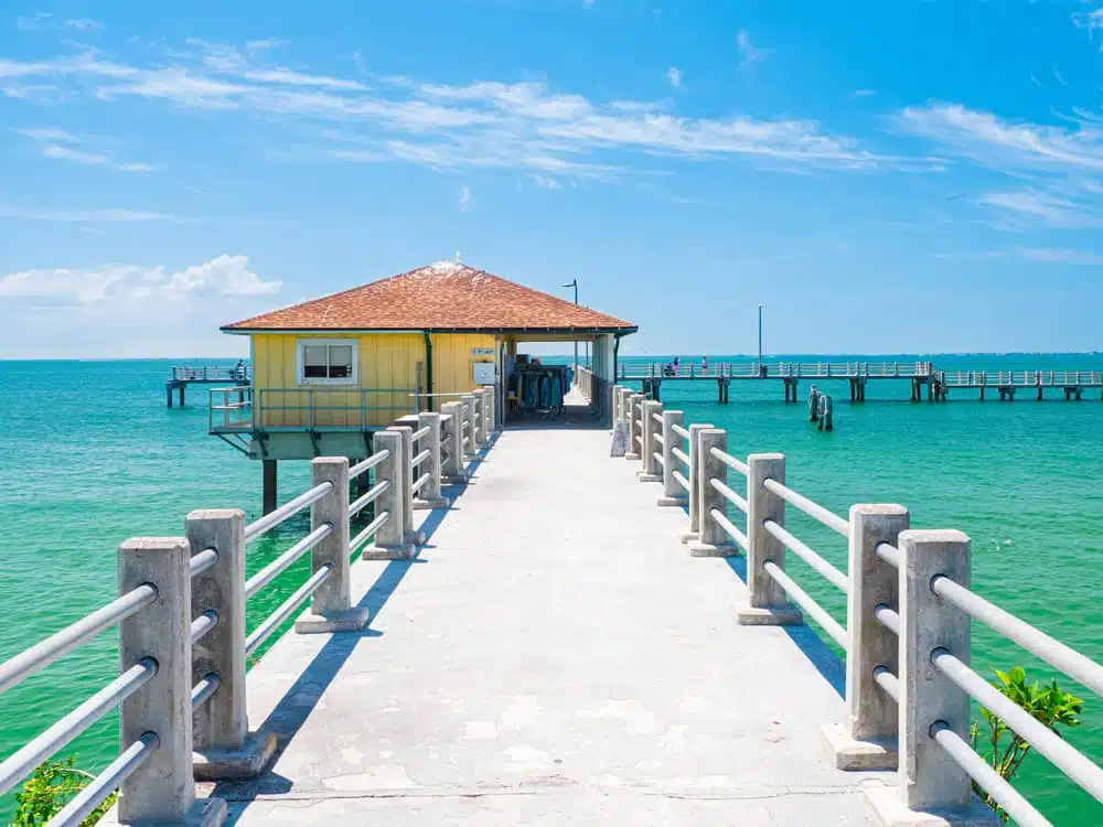 The Fort De Soto Campground will reopen with a vibrant yellow pier and a charming yellow house that gracefully rests on the glistening water.