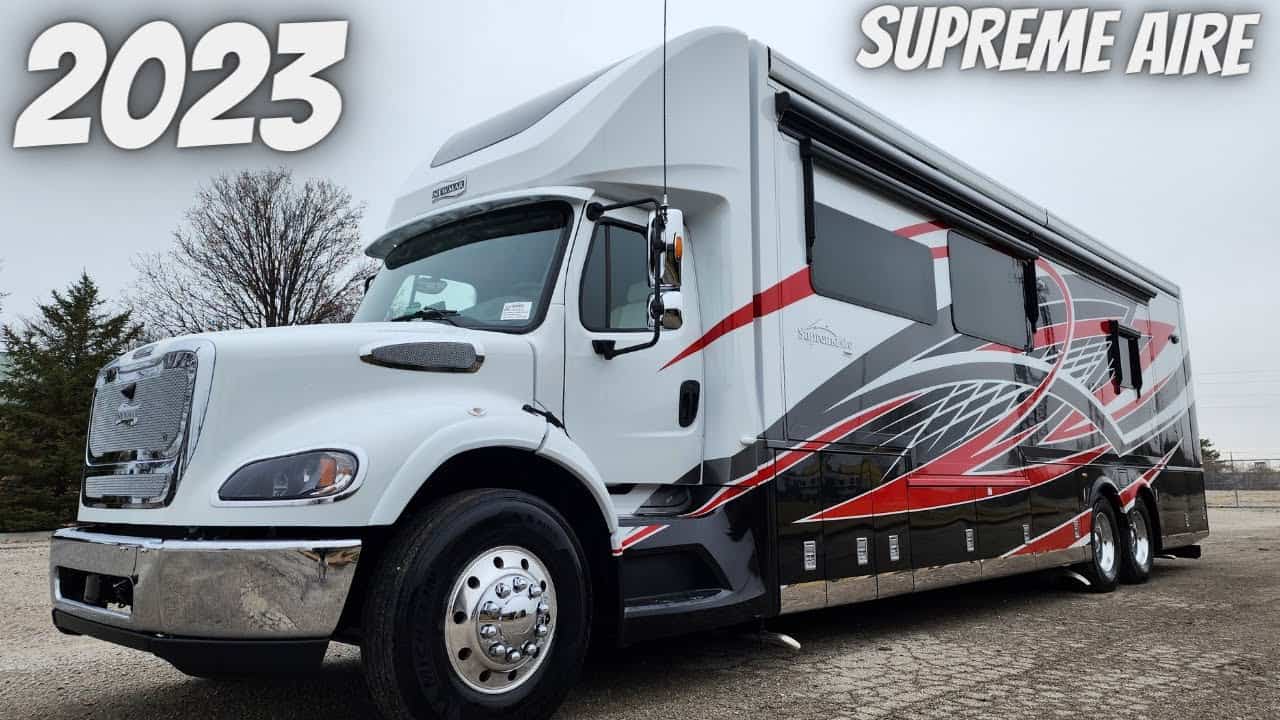 The 2023 Newmar Supreme Aire, the nicest Class C RV on the market, is parked in a dirt lot.