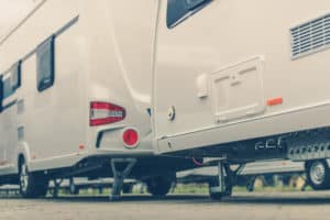 A group of RVs parked in a parking lot, reflecting the decline in Canada RV wholesale shipments according to the CRVA Report.