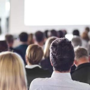 A group of people in an auditorium watching a presentation organized by BC Recreation.