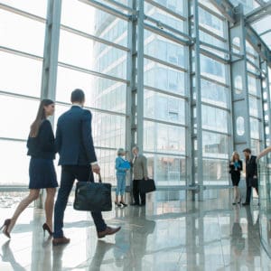 The RVIA Government Affairs Team, consisting of e-RV Infrastructure experts and business people, walking through an office building.