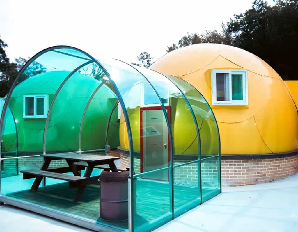 A partnership between Glampitect North America and Alberta-Based NovaDome has resulted in a group of colorful domes with a picnic table in the middle.