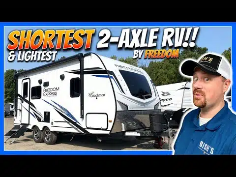 A man is standing in front of the lightest compact RV on the market - the 2023 Coachmen Freedom Express 192RBS.