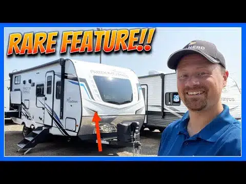 A man is standing in front of a Family-Friendly Luxury RV with the words "rare feature.