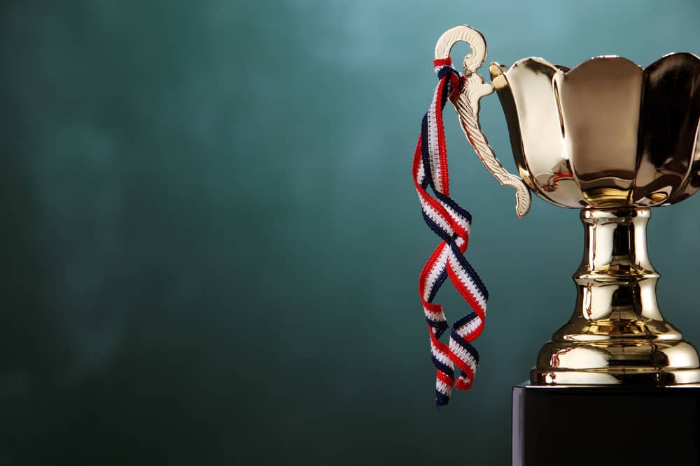 A gold trophy, representing an award nominations criteria, sits on top of a black background at the CCRCV.