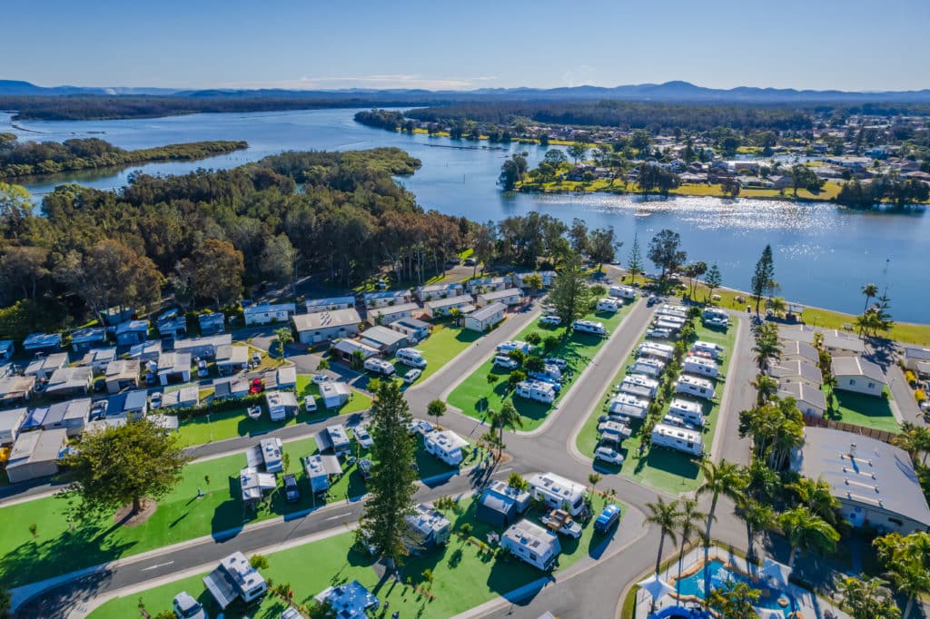 An aerial view of an RV park near a river in Australia.