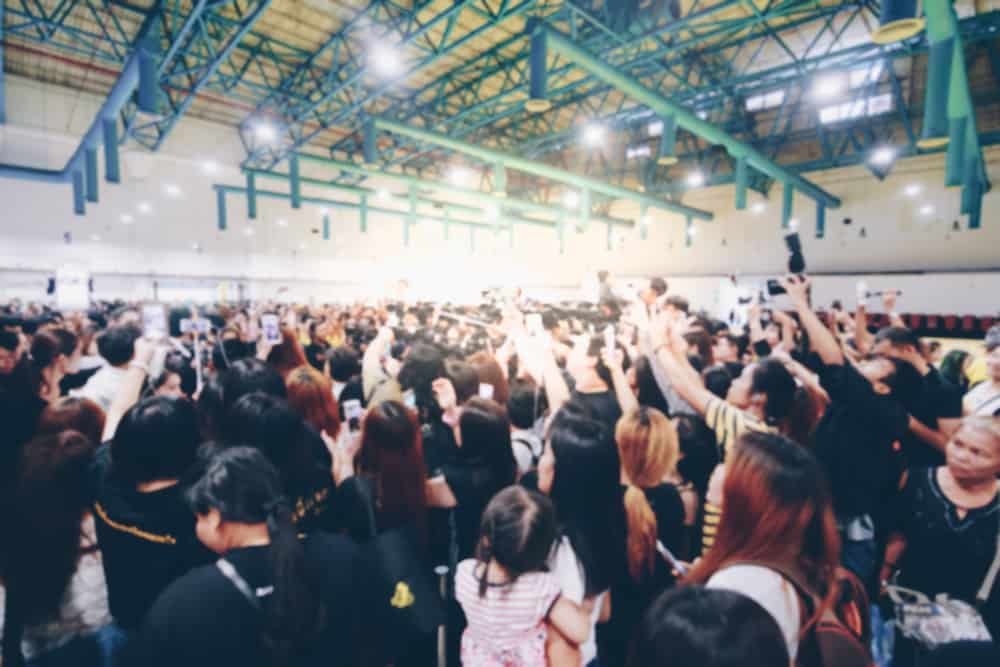 A crowd of people enjoying an electrifying concert powered by Zendure's SuperBase V, the ultimate portable power solution.