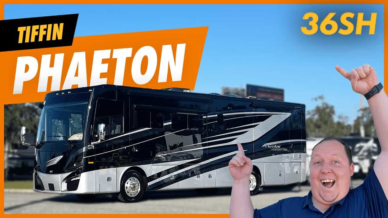 A man is standing in front of a luxury RV with the words tiffin phaeton 360hs.