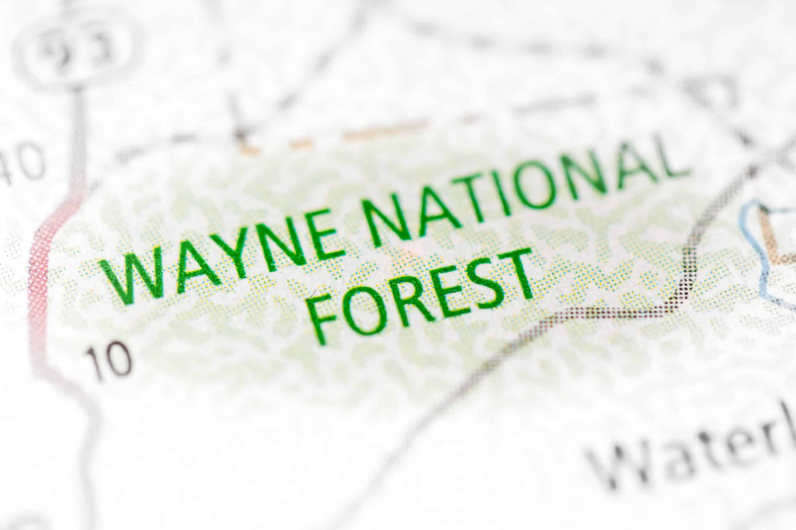 Wayne National Forest is prominently featured on a map, highlighting its location and boundaries. The map provides relevant information for visitors, including the upcoming Recreation Season beginning on April 7th.