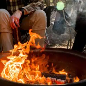 Steve Stafford, Director of Franchise Sales for Yogi Bear's Jellystone Park, sits around a campfire.