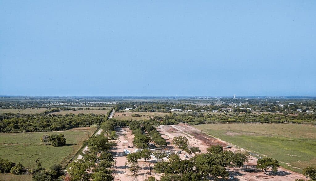 An aerial view of a field and trees in New Braunfels.