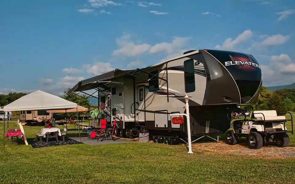 An RV parked at Luray RV Resort on a grassy field, showcasing the expansion.