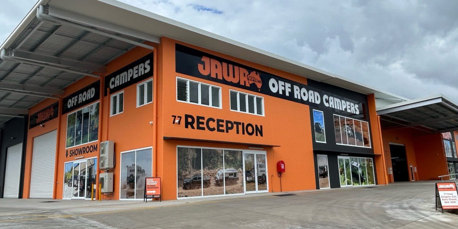 A new facility on the Sunshine Coast, featuring an orange and black building with a sign advertising JAWA Off Road Campers.