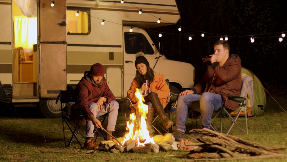 A group of RVers sitting around a campfire.