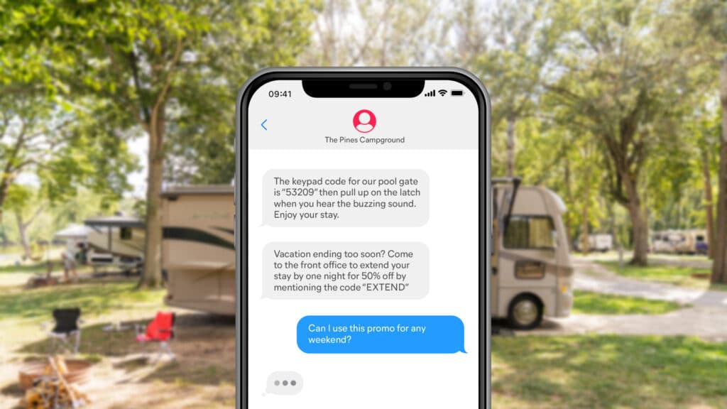 A text message is displayed on an iphone with a rv in the background, featuring the integration of a Two-Way Text Option for Campspot.