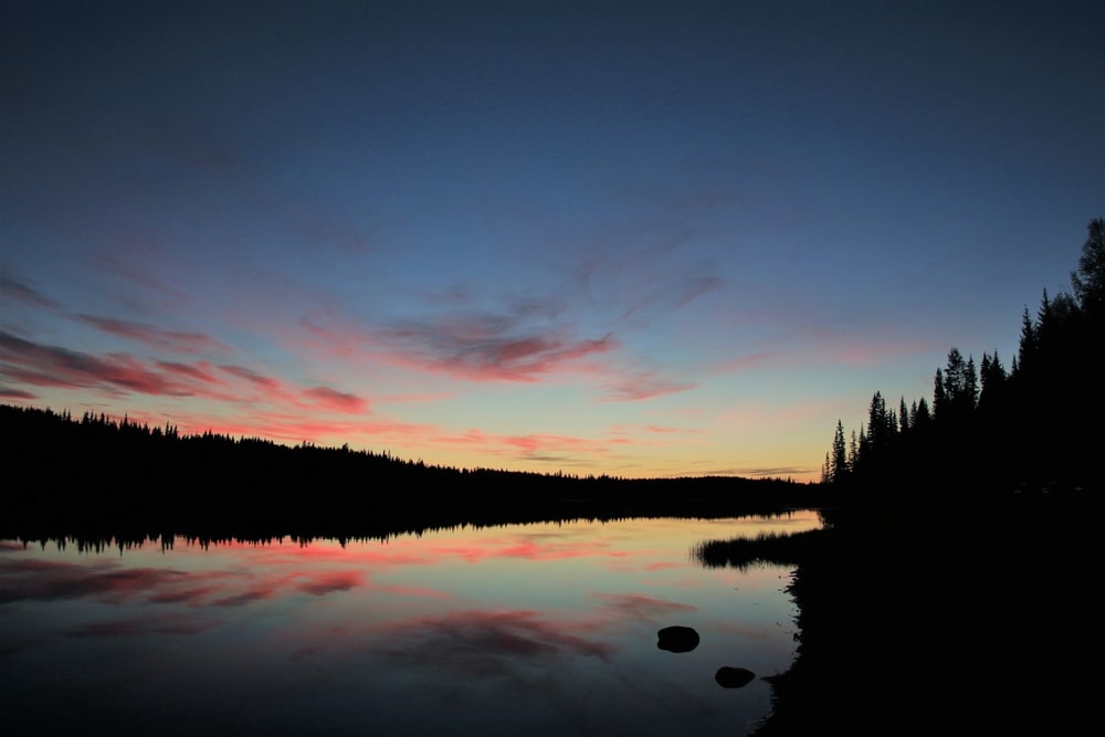 Andy Bailey enjoys the accessibility of a sunset over a lake with trees in the background, and continues to find ways to improve it.