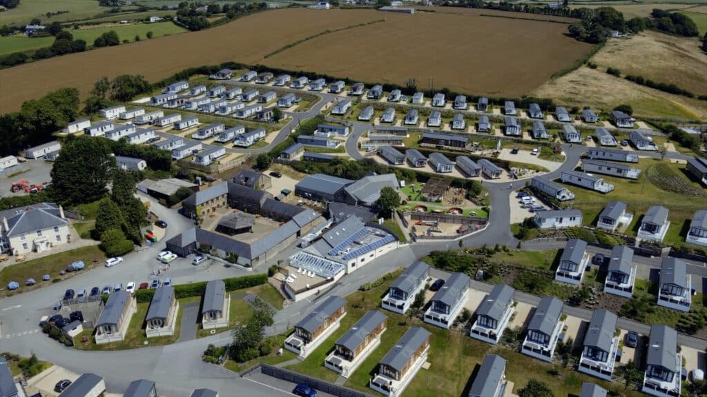 A Luxurious aerial view of the Tregoad Holiday Park, Cornwall's Premier Destination in a residential area.