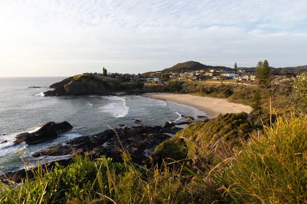 A beachfront escape with a view of a rocky shore in Nambucca Heads.