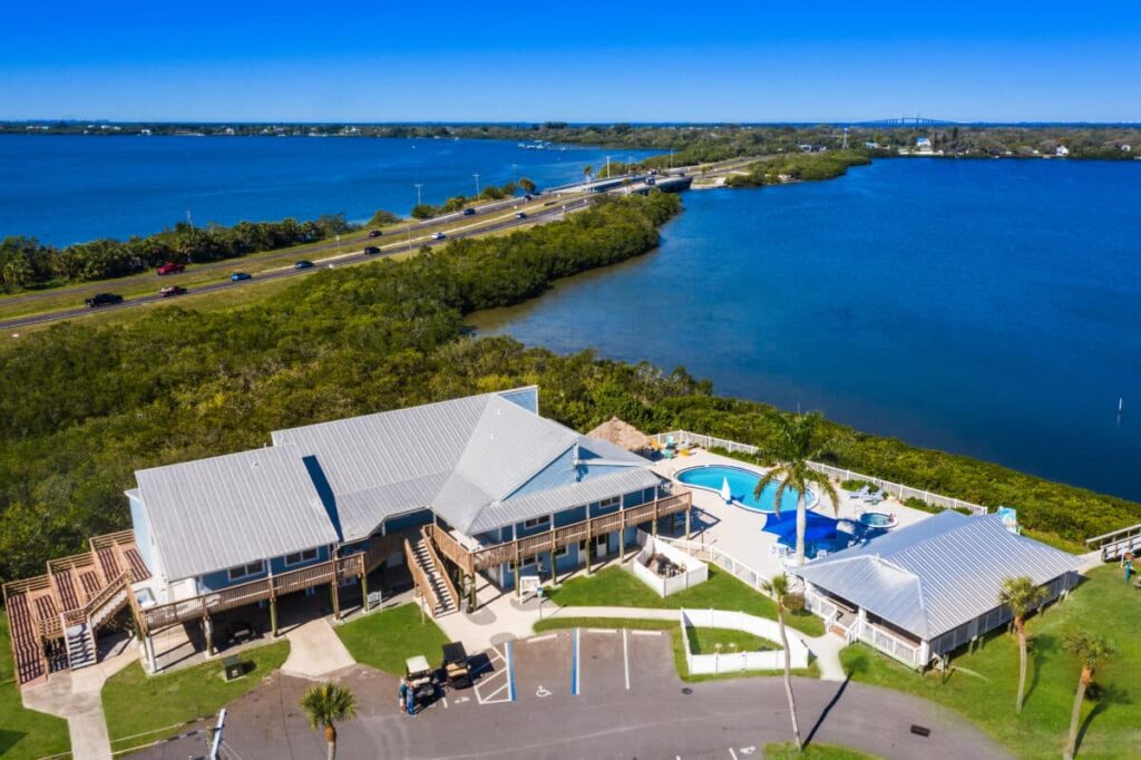 An aerial view of a serene house on the water at a Florida RV Resort.