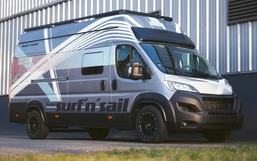 A surf camper van parked in front of a building, redefining the camper van market.