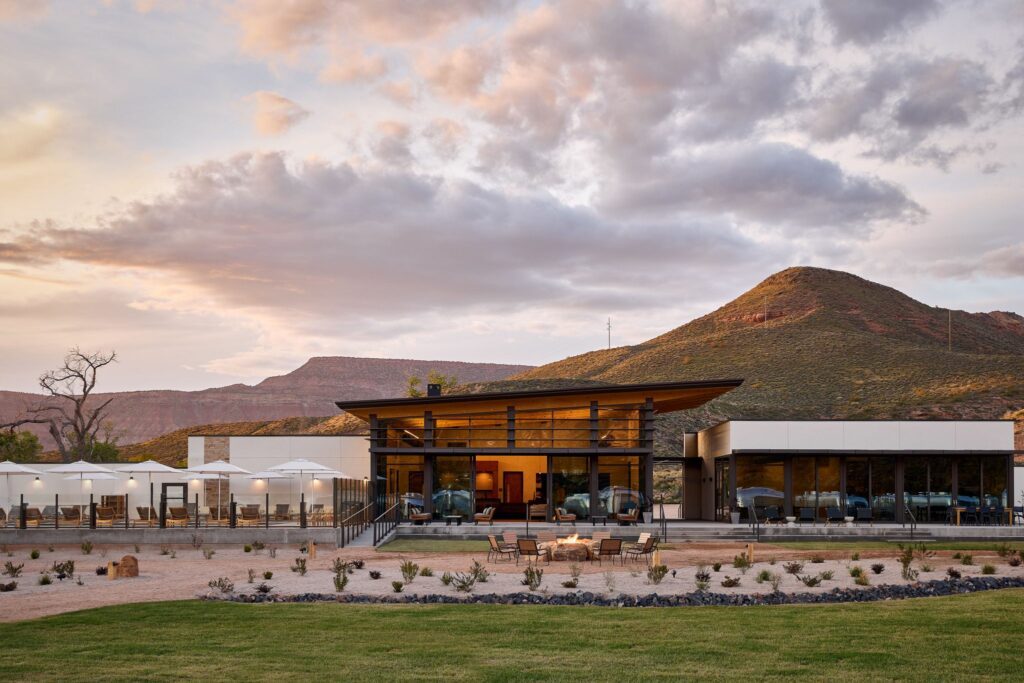 A Hilton restaurant with a view of the mountains at sunset.