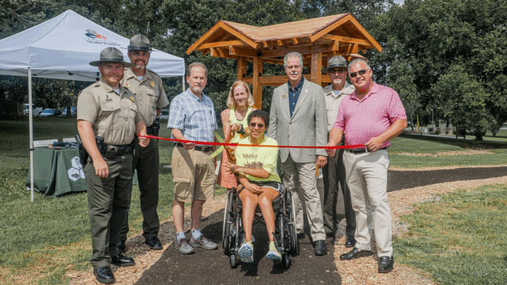Tennessee State Parks leadership joined lawmakers and members of Achillies International to open a new accessible trail at Henry Horton State Park. L-R: Henry Horton State Park Manager Shaun Rainone, Tennessee State Parks Area Manager Jacob Young, Sen. Joey Hensley, Amy Harris, Sara “Lizzy” Harris, TDEC Deputy Commissioner Greer Tidwell, Tennessee State Parks Director of Operations Kim Moore, and Rep. Todd Warner.
